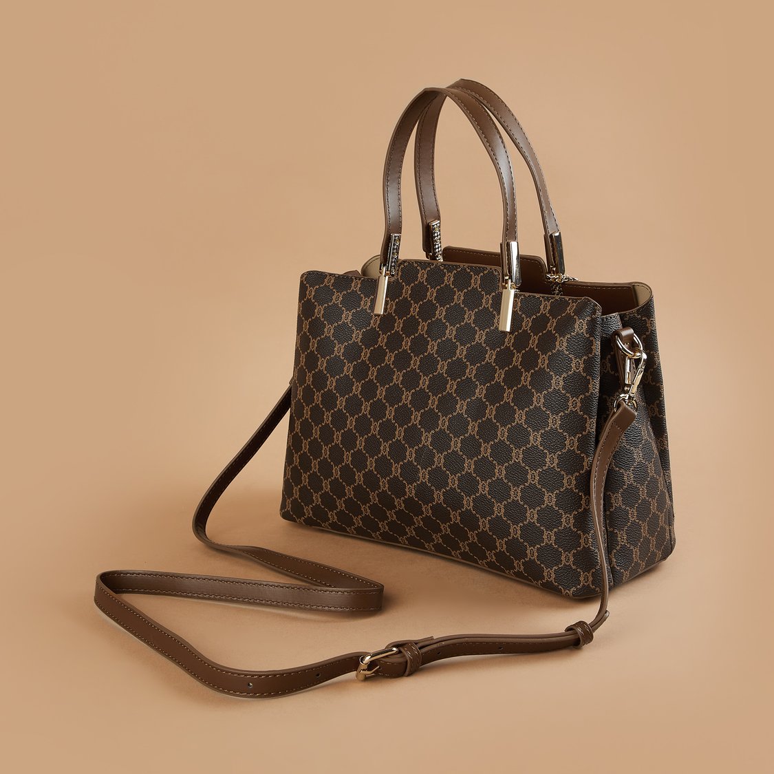 Buy CODE Monogram Print Handheld Bag from CODE at just INR 2299.0