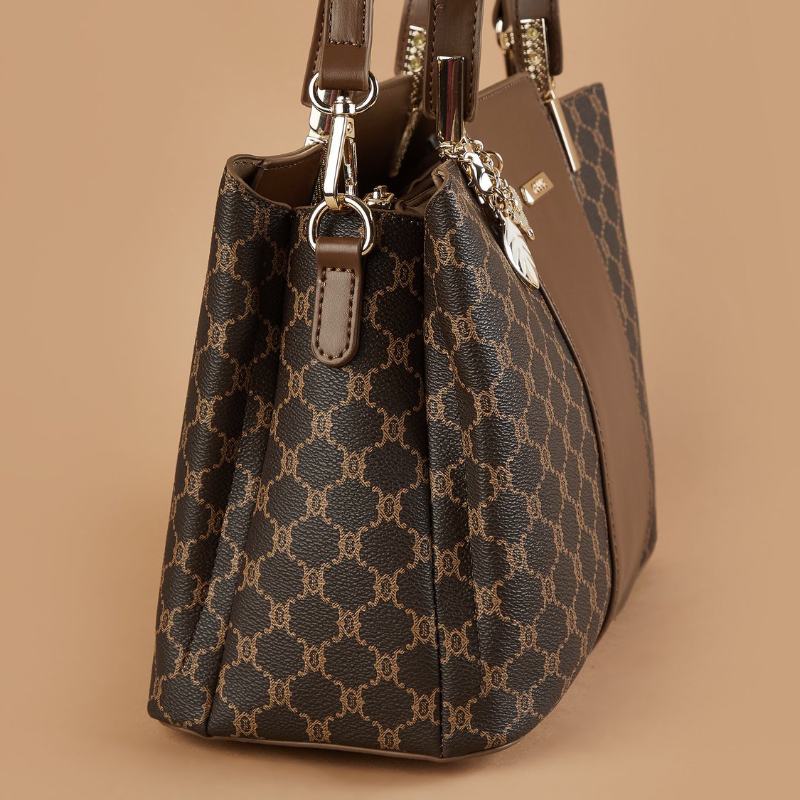 Buy CODE Monogram Print Handheld Bag from CODE at just INR 2299.0