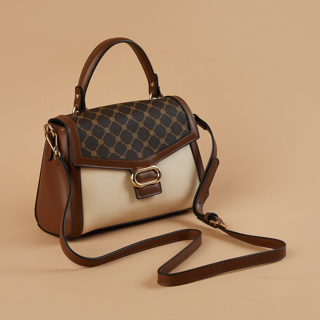 Buy CODE Monogram Print Handheld Bag from CODE at just INR 2299.0