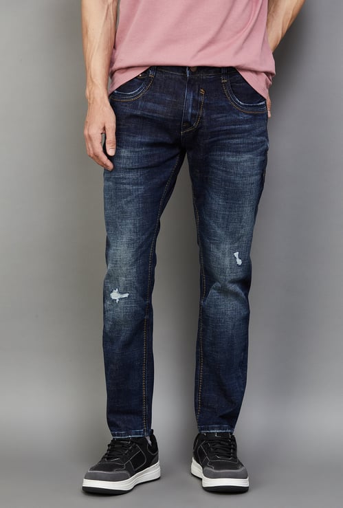 SPYKAR Distressed Slim Tapered Jeans