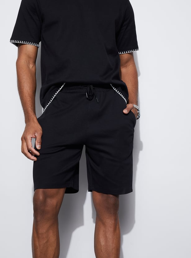 Buy CODE UNWIND Solid Regular Fit Shorts from Code Unwind at just