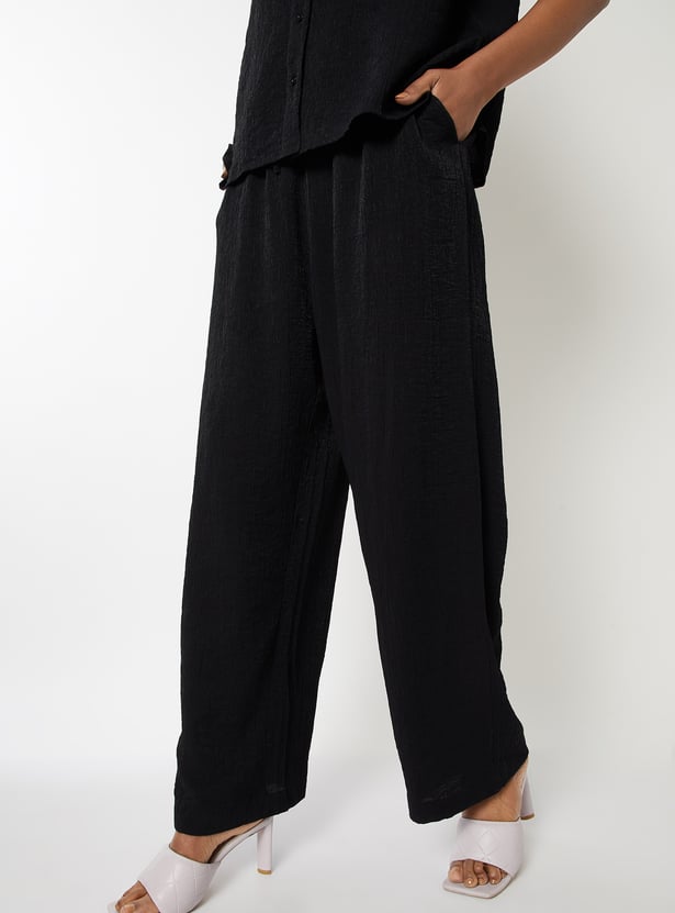 Buy Women Textured Wide Leg Trousers Online at just Rs. 799.0